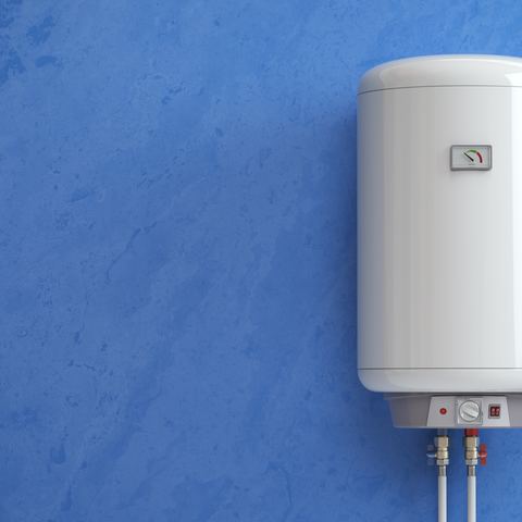 Two insulated hot water storage cylinders beside a wall-hung unit and an expansion vessel